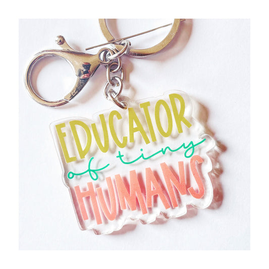 An image of a keyring with the slogan 'Educator of Tiny Humans', perfect for showing appreciation to teachers, who are invaluable in helping shape young minds and futures. A unique and humorous gift for any educator or teacher in your life.